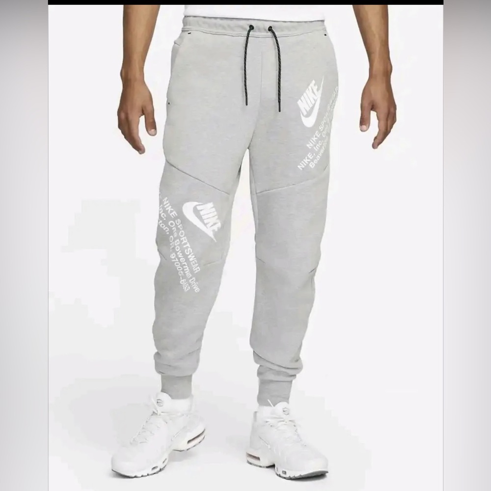 Nike Gray Joggers with White Swoosh and Tapered Fit
